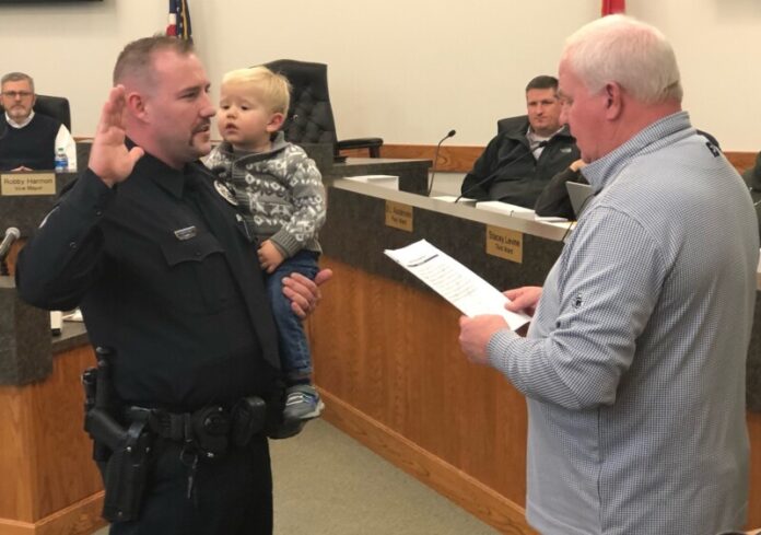 officer dyllon larson takes peace officers oath